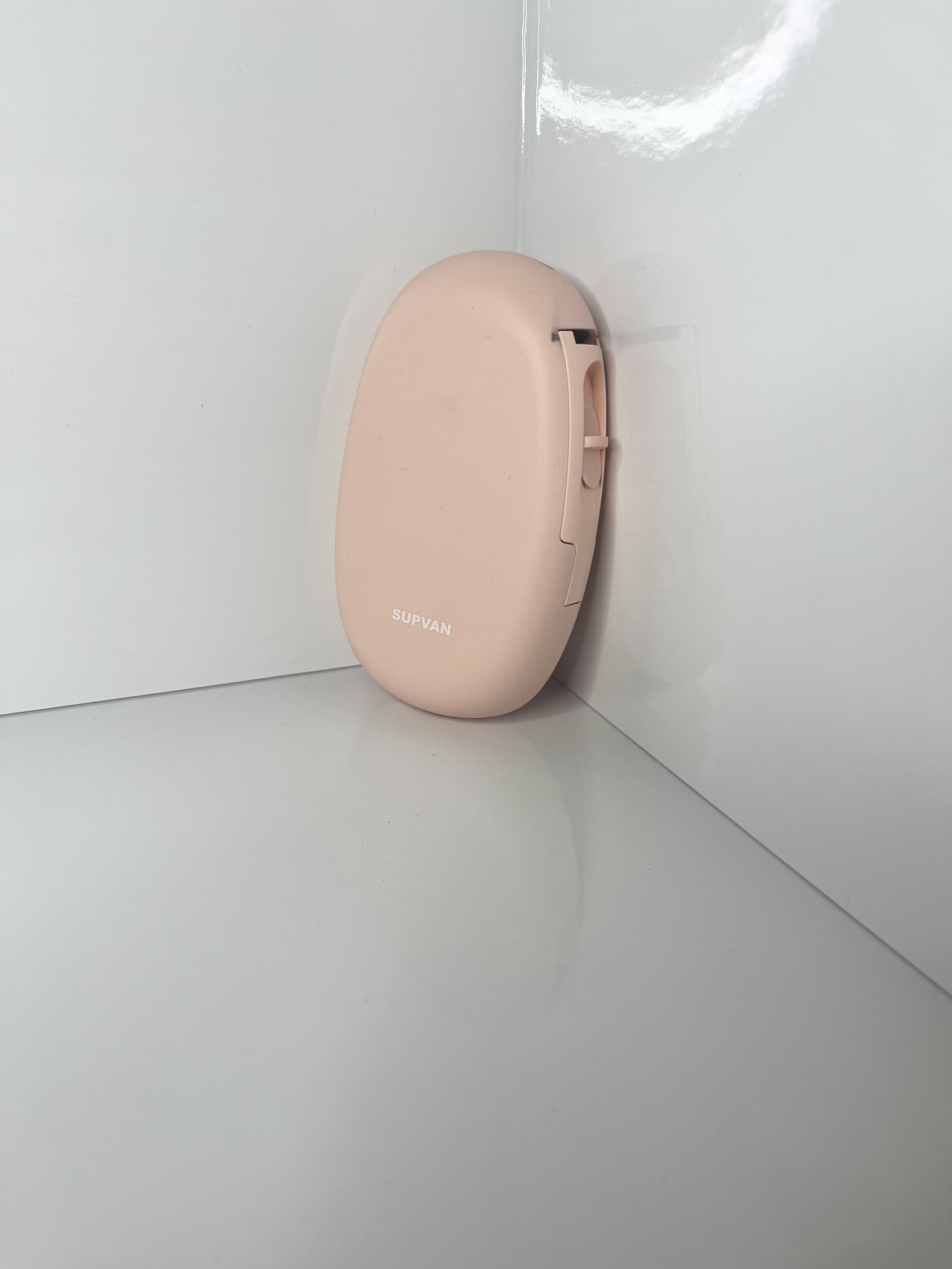 A similar upright view emphasizes the printer’s vertical orientation and minimal design details.